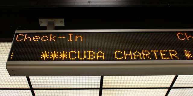 MIAMI - APRIL 07: A check-in sign for the ABC Charter flight to Cuba is seen at Miami International Airport on April 7, 2009 in Miami, Florida. Reports indicate that U.S. President Barack Obama plans to loosen restrictions on family travel and remittances to Cuba. (Photo by Joe Raedle/Getty Images)