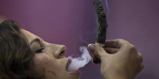 April Angeloni from California during the competition for the longest ash in Havana, on Feb. 27, 2014.