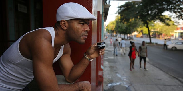 A man has his morning coffee in Havana, Cuba. (Photo by Joe Raedle/Getty Images)