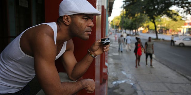 A man has his morning coffee in Havana, Cuba. (Photo by Joe Raedle/Getty Images)