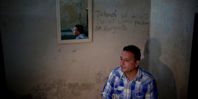 A day after his release, dissident Wilberto Parada, 42, sits for an interview in his home in Havana, Cuba, Friday, Jan. 9, 2015. Advocates, relatives and dissidents say that Cuba has freed at least 38 people on a U.S. list of imprisoned opposition members. U.S. officials said Friday after weeks of virtual silence that those released had been on the list of 53. (AP Photo/Ramon Espinosa)