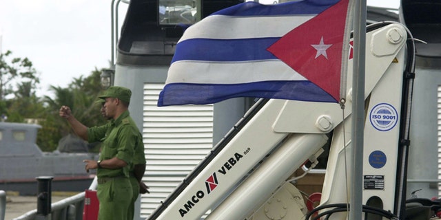 HAVANA, CUBA - OCTOBER 5: Cuban soldiers stand on the deck of a Havana Coast Guard boat dedicated to intercepting drug traffickers October 5, 2004 in Havana, Cuba. Cuban authorities said drug smuggling operations from South America to the U.S. have been foiled by increased patrols by sea and air. (Photo by Jorge Rey/Getty Images)