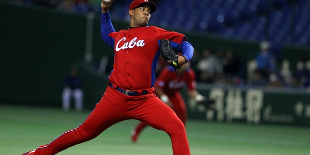TOKYO, JAPAN - MARCH 11: Starting Pitcher Vladimir Garcia #34 of Cuba pitches during the World Baseball Classic Second Round Pool 1 game between Cuba and the Netherlands at Tokyo Dome on March 11, 2013 in Tokyo, Japan. (Photo by Koji Watanabe/Getty Images)