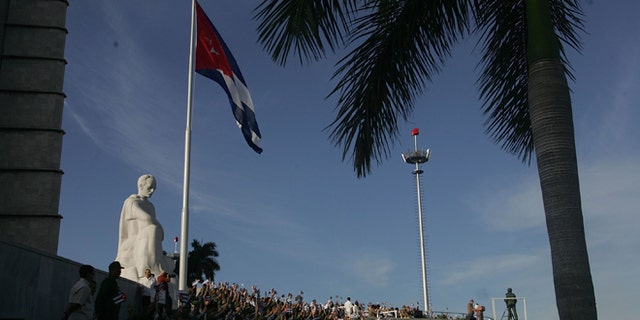 HAVANA, CUBA - DECEMBER 02: Cuba's acting President Raul Castro speaks in front of the Jose Marti statue in Havana's Revolution Square during the parade to mark the 50th anniversary celebration of the forming of Cuba's Revolutionary Armed Forces December 2, 2006 in Havana, Cuba. Many in the crowd were hoping to catch a glimpse of Cuban President Fidel Castro who did not attend the parade. (Photo by Joe Raedle/Getty Images)