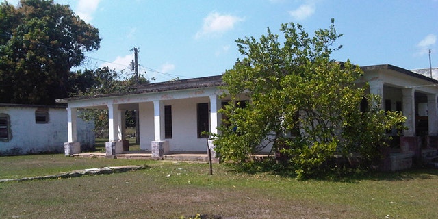 This Friday, March 20, 2105 photo shows the house that used to belong to U.S. citizen Daniel Smith in the Isle of Pines, Cuba. The property was confiscated by the new Cuban government after the revolution. (AP Photo/Milexy Duran)