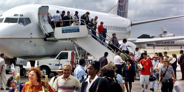 In this Nov. 1, 2001, file photo, the first passengers of the first flight of Continental Airlines from Miami Florida, arrives at the Jose Marti Airport of Havana, Cuba.