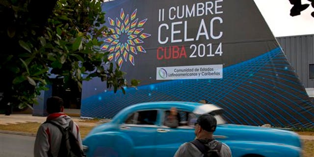 A sign announces the CELAC summit in Havana, Cuba, Friday, Jan. 24, 2014. Havana will host the meeting of Latin American and Caribbean leaders, January 28-29. (AP Photo/Ramon Espinosa)