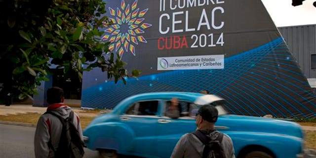 A sign announces the CELAC summit in Havana, Cuba, Friday, Jan. 24, 2014. Havana will host the meeting of Latin American and Caribbean leaders, January 28-29. (AP Photo/Ramon Espinosa)
