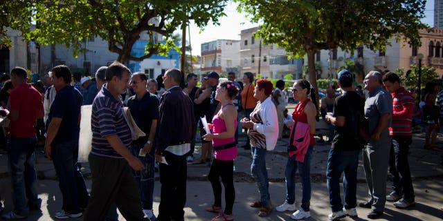 Jan. 14, 2013 - People wait to enter the U.S. Interests Section to apply for U.S. visas in Havana, Cuba.
