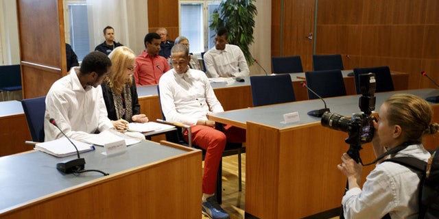 Players of Cuba's national volleyball team accused of rape appear before the court of Tampere, Finland, on August 29, 2016.