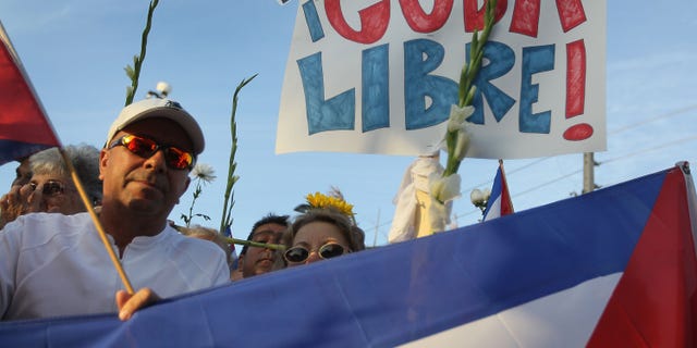 People show their support for an activist group in Cuba.