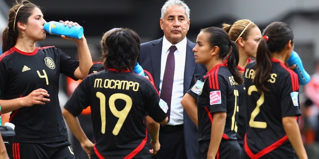 Head coach Leonardo Cuellar of Mexico stands next to his team after the FIFA Women World Cup 2011 Group B match between Japan and Mexico. (Photo by Alex Grimm/Getty Images)