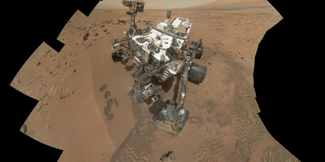 This image released by NASA shows the work site of the NASAs rover Curiosity on Mars.