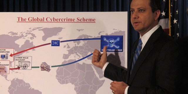 Preet Bharara, U.S. Attorney for the Southern District of New York, explains a Global Cybercrime chart at a press conference announcing dozens of charges against an international group of cybercrimnials.