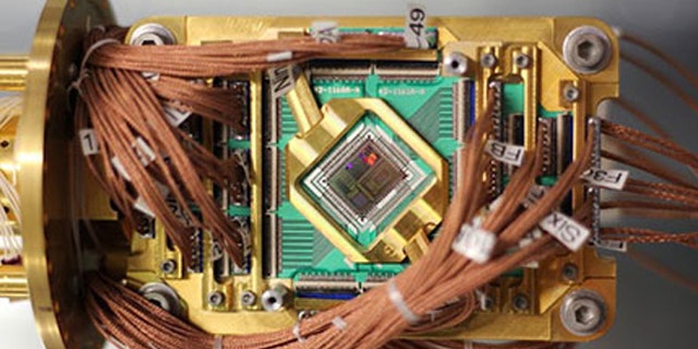 An experimental computer made by a Canadian company has proved its ability to solve increasingly complex mathematical problems. But is it quantum mechanics?