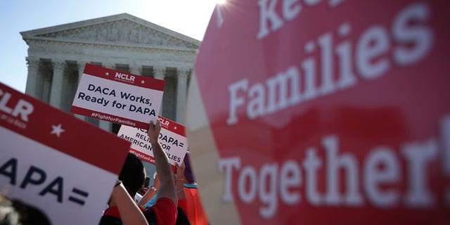 Pro-immigration activists gather in front of the U.S. Supreme Court on April 18, 2016 in Washington, DC.