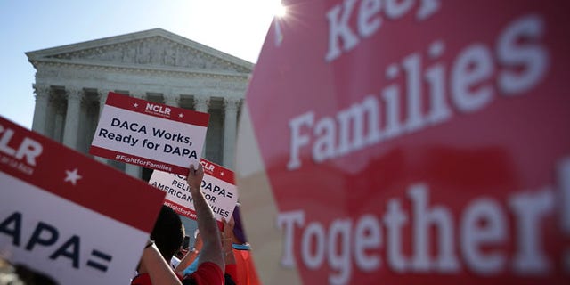 Pro-immigration activists gather in front of the U.S. Supreme Court on April 18, 2016 in Washington, DC.