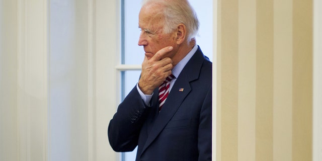 FILE - In this May 26, 2015 file photo, Vice President Joe Biden listens to remarks to the media during a meeting between President Barack Obama and NATO Secretary General Jens Stoltenberg in the Oval Office of the White House in Washington.(AP Photo/Pablo Martinez Monsivais, File)