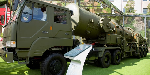 The Dong Feng 21A and launcher vehicle are displayed at the Beijing Military Museum. China is reportedly working on developing the world's first antiship ballistic missile based on a similar design.