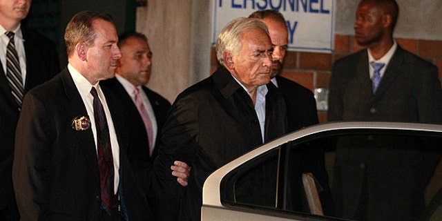 May 16: Dominique Strauss-Kahn, head of the International Monetary Fund, is taken away from a police station in New York where he was being held.