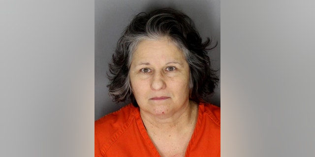This undated booking photo provided by the the Oakland County Sheriffs Office shows Sylvia Majewska. Majewska is charged with first-degree murder in the Nov. 23, 2014, killings at her home in Oakland County's Addison Township, 45 miles north of Detroit. A judge in Rochester Hills put proceedings on hold Thursday, Feb. 12, 2015, after a psychiatrist said Majewska is incompetent to stand trial. (AP Photo/Oakland County Sheriffs Office via Detroit Free Press)