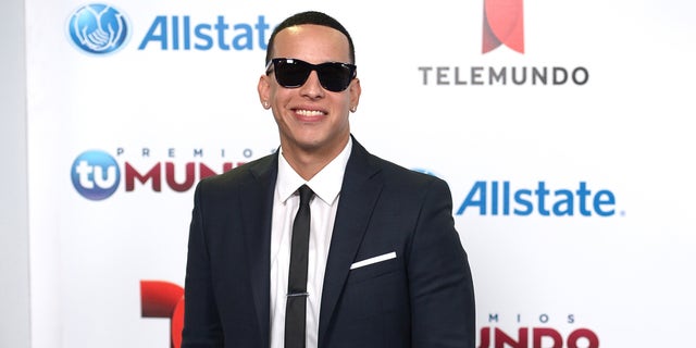 Daddy Yankee arrives for Telemundo's Premios Tu Mundo Awards at American Airlines Arena on August 15, 2013 in Miami, Florida.