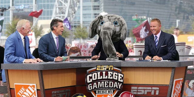 Sep 1, 2012; Arlington, TX, USA; Dallas Cowboys owner Jerry Jones (far left) on the set of ESPN College Gameday with Chris Fowler (second to left) and Lee Corso (in elephant costume) and Kirk Herbstreit (far right) before the game between the Alabama Crimson Tide and the Michigan Wolverines at Cowboys Stadium. Mandatory Credit: Kevin Jairaj-USA TODAY Sports