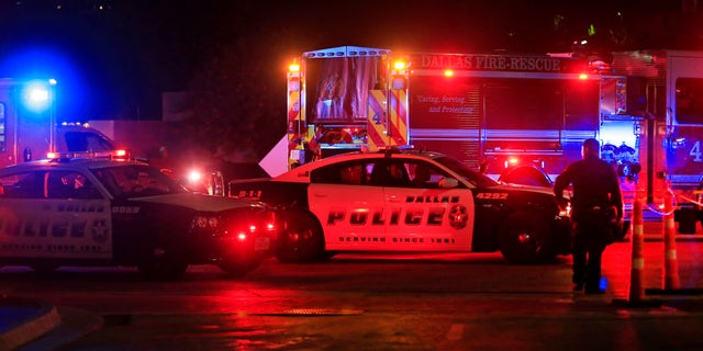 Dallas police work near the scene where eleven Dallas police officers were shot and five have now died on July 8, 2016 in Dallas, Texas. According to reports, shots were fired during a protest being held in downtown Dallas in response to recent fatal shootings of two black men by police - Alton Sterling on July 5, 2016 in Baton Rouge, Louisiana and Philando Castile on July 6, 2016, in Falcon Heights, Minnesota. (Photo by Ron Jenkins/Getty Images)