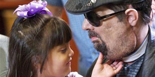 Full face transplant patient Dallas Wiens is seen with his 4-year old daughter Scarlette in this undated handout image.