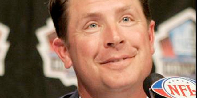 Former Miami Dolphins quarterback Dan Marino gives the thumbs up after being elected into the NFL Pro Football Hall of Fame.