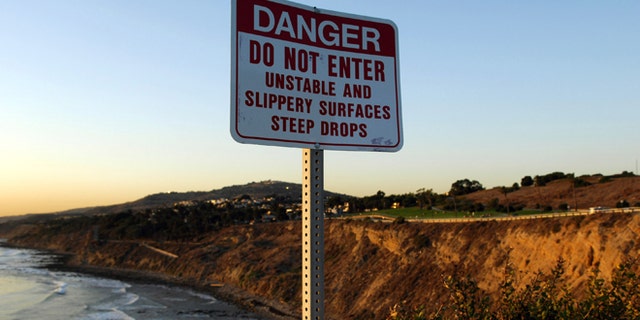A Danger sign at Point Fermin Park in San Pedro, Calif. on Monday, January 8, 2007. The body of USC kicker Mario Danelo, 21, was found at the bottom of the rocky San Pedro cliff on Jan. 6. Los Angeles Police Department officials have ruled the death either an accident or suicide. (Photo by Kirby Lee/Getty Images)