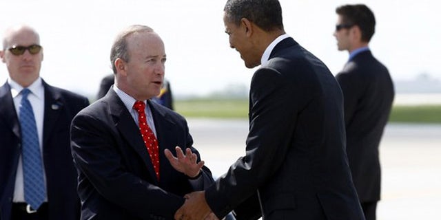 May 6: President Obama is greeted by Indiana Governor Mitch Daniels upon his arrival in Indianapolis.