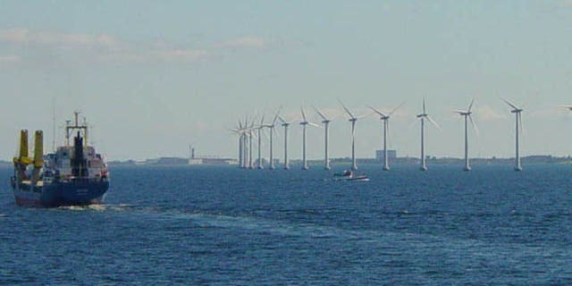 Danish wind turbines spin slowly off the coast of Copenhagen.