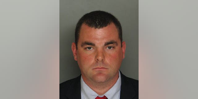 This April 7, 2015, booking photo provided by Edgefield County Detention Center, shows Justin Craven, a North Augusta, S.C., police officer, who is charged in the shooting death of an unarmed driver in February 2014 in South Carolina. State police in South Carolina refuse to release dashcam video that apparently shows the white police officer shooting a 68-year-old black man to death in his driveway after a nine-mile car chase. (Edgefield County Detention Center via AP)