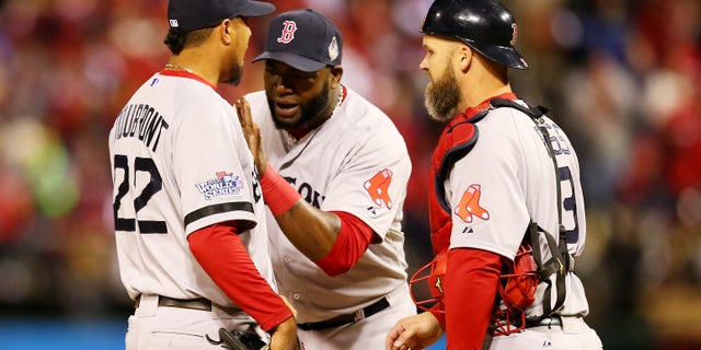 ST LOUIS, MO - OCTOBER 27: David Ortiz #34 and David Ross #3 of the Boston Red Sox talk with pitcher Felix Doubront #22 against the St. Louis Cardinals during Game Four of the 2013 World Series at Busch Stadium on October 27, 2013 in St Louis, Missouri. (Photo by Ronald Martinez/Getty Images)