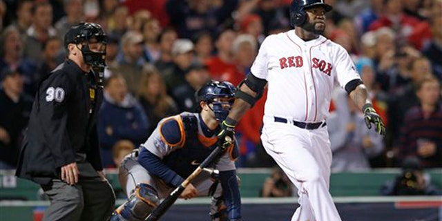 Boston Red Sox's David Ortiz hits a grand slam home run in the eighth inning during Game 2 of the American League baseball championship series against the Detroit Tigers Sunday, Oct. 13, 2013, in Boston. (AP Photo/Elise Amendola)