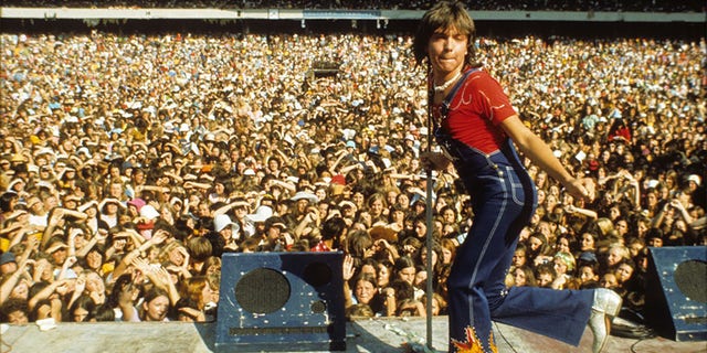A young David Cassidy performs at Melbourne Cricket Grounds in Australia in 1974 in an archival photo which airs as part of A&E’s Biography Presents: "David Cassidy: The Last Session" premiering Monday, June 11 at 9PM ET/PT.