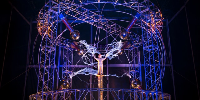 Oct. 5, 2012: Magician David Blaine stands inside an apparatus surrounded by a million volts of electric currents streamed by tesla coils during his 72-hour "Electrified: 1 Million Volts Always On" stunt on Pier 54