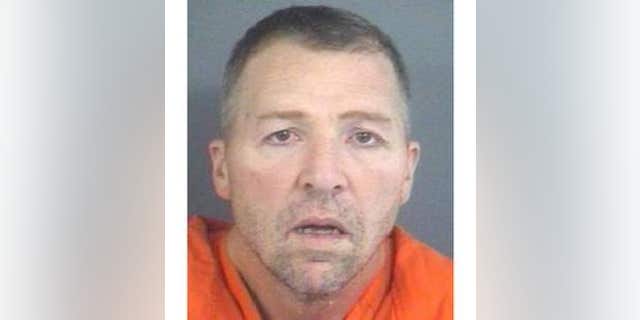 David E. Ison, 46, charged with five counts of murder in Indiana.