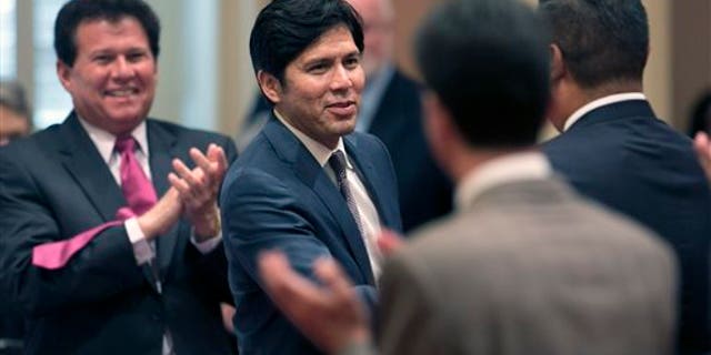 California Senate leader Kevin de Leon shaking hands with lawmakers in 2014.