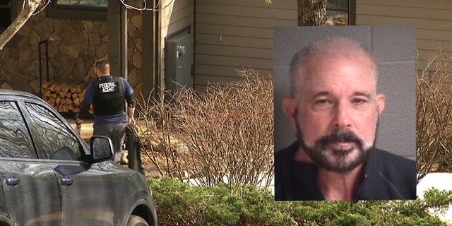 In this image taken from video, federal agents execute a search warrant at the Sapphire, N.C., home of Jose Lantigua on Monday, March 23, 2015. Lantigua, a Jacksonville businessman reported dead two years ago in Venezuela, was arrested in North Carolina on Saturday, March 21, on alleged fraud charges after his life insurance companies filed a lawsuit alleging he was alive and they shouldn't be making payments. (AP Photo/Alex Sanz)
