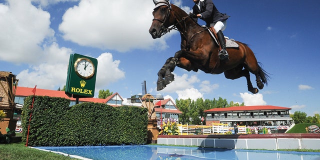 CALGARY, CANADA - SEPTEMBER 08: Andres Rodriguez of Venezuela riding Caballito competes in the individual jumping equestrian on the final day of the Masters tournament at Spruce Meadows on September 8, 2013 in Calgary, Alberta, Canada. Andres placed 18th with a time of 91.49 and 8 faults. (Photo by Derek Leung/Getty Images)