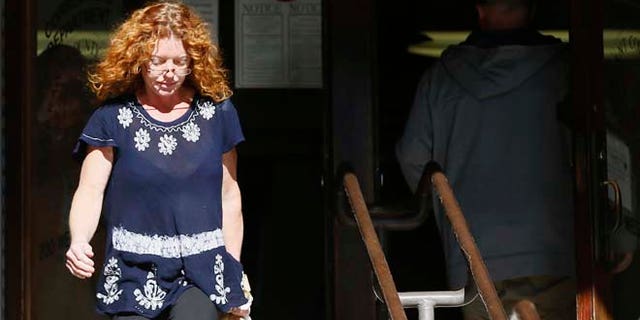 Wearing a GPS monitor on her left ankle, Tonya Couch, the mother of a Texas teen who used an "affluenza" defense in a drunken wreck, leaves Tarrant County Community Supervision and Corrections Department on Tuesday, Jan. 12, 2016, in Fort Worth, Texas. A judge decreased Couch's bond Monday from $1 million to $75,000. Couch is charged with hindering the apprehension of a felon after she and her son, Ethan Couch, were caught in a Mexican resort city. (AP Photo/Brandon Wade)