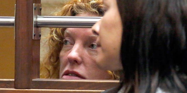 Tonya Couch, left, attends an extradition hearing at the Los Angeles Superior Court, in Los Angeles, Tuesday, Jan. 5, 2016. Couch, mother of a fugitive teenager known for using an "affluenza" defense in a deadly drunken-driving case, waived extradition and will be sent to Texas to face a charge of hindering the apprehension of a felon. (Genaro Molina/Los Angeles Times via AP, Pool)