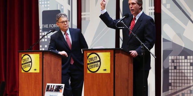 Oct. 1, 2014: Democratic U.S. Sen. Al Franken, left, listens as his Republican challenger Mike McFadden gives his closing statement during their debate.