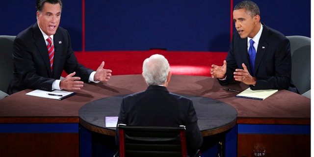 Oct. 22, 2012: Republican presidential nominee Mitt Romney and President Barack Obama answer a question during the third presidential debate at Lynn University, in Boca Raton, Fla.