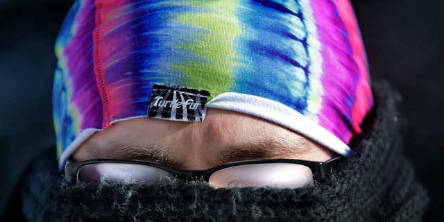 FILE: January 6, 2014: The cold weather makes vision challenging as Jobin Curow's glasses fog up while walking in subzero temperatures on the Lawrence University campus in Appleton, Wis.