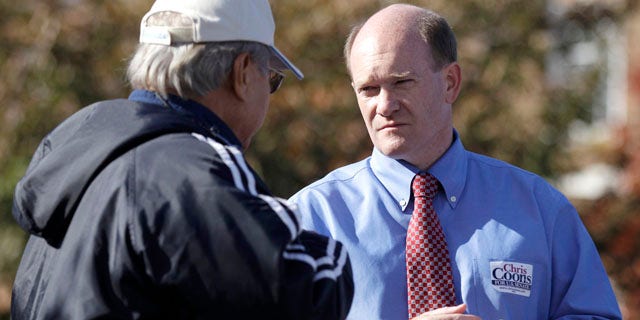 Nov. 2: Delaware Democratic Senate candidate Chris Coons, right, outside a polling station in Dover, Del.