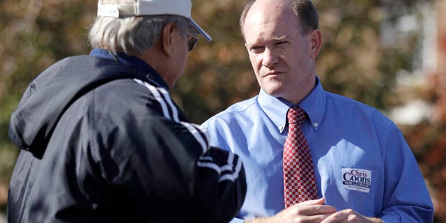 Nov. 2: Delaware Democratic Senate candidate Chris Coons, right, outside a polling station in Dover, Del.