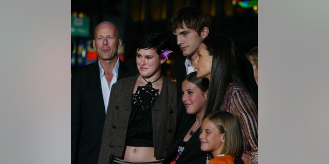 Actress Demi Moore,(R) one of the stars of the new film "Charlie's Angels
Full Throttle" arrives with actor Ashton Kutcher (C) and her daughters (L-R)
Rumer Glenn Willis, Scout LaRue Willis and Tallulah Belle Willis, along with
her ex-husband, actor Bruce Willis (Far L) for the film's premiere in
Hollywood June 18, 2003. Moore and Kutcher have reportedly been dating. The
film stars Lucy Liu, Drew Barrymore and Cameron Diaz and opens June 27 in
the United States. PP03060056 Pictures of the Year 2003
REUTERS/Fred Prouser
FSP